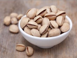 A container of shelled pistachios.