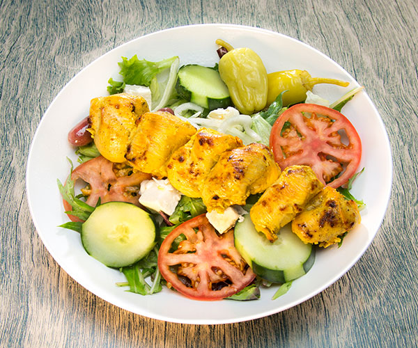Chicken with salad and feta cheese cubes