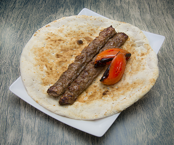 Kubideh and tomatoes served on pita