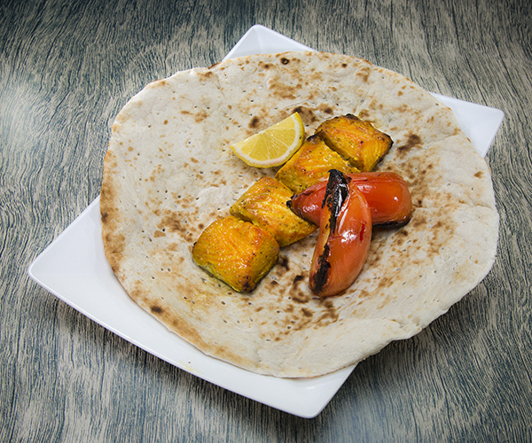 Juicy cubes of salmon with pita bread