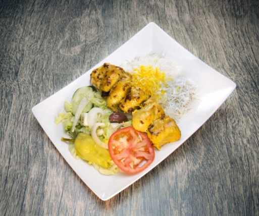 Chicken served with rice and salad