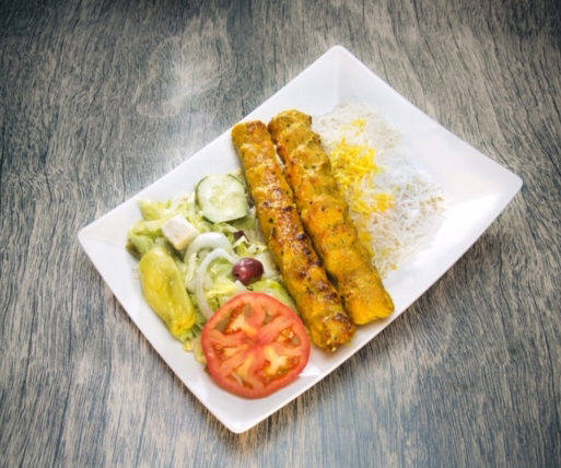 Spicy chicken served with half rice and half salad