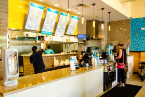 A customer orders food at Moby Dick's Dunn Loring Location