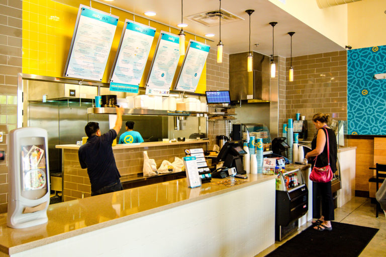 A customer orders food at Moby Dick's Dunn Loring Location